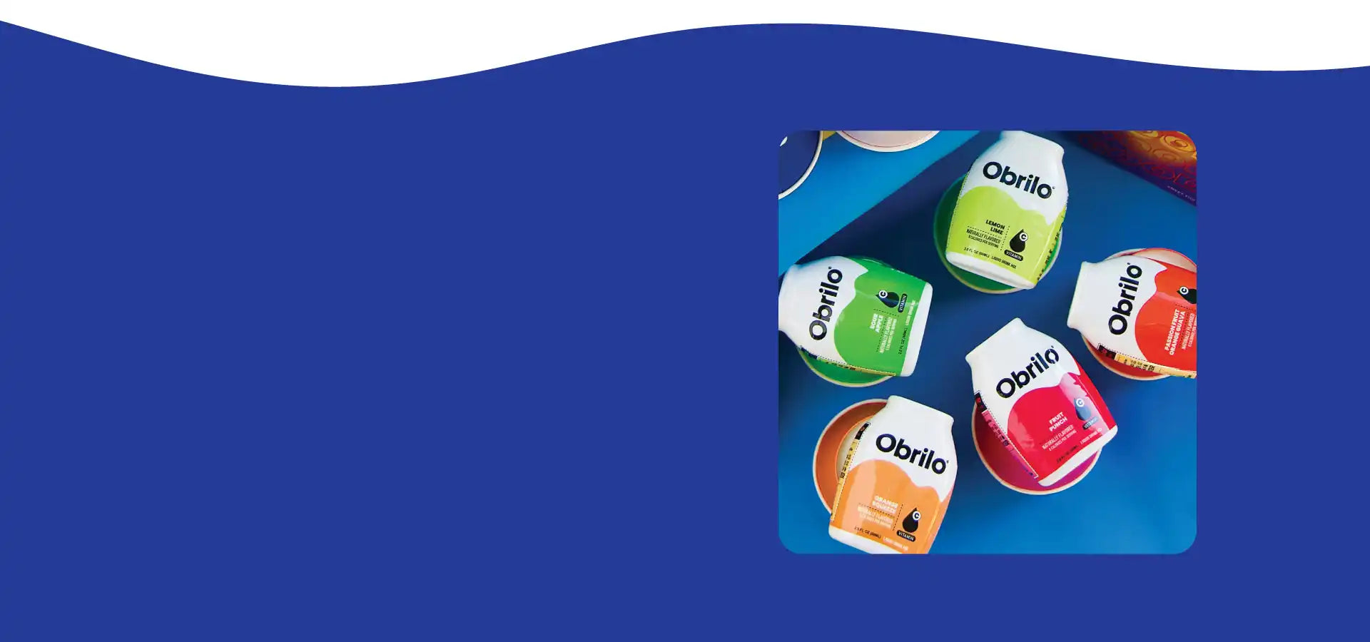 A group of five bottled probiotic drinks in various fruit flavors.