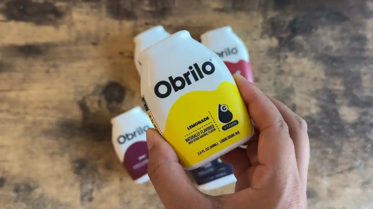 A small, white bottle of ’Obrilo’ brand lemonade.
