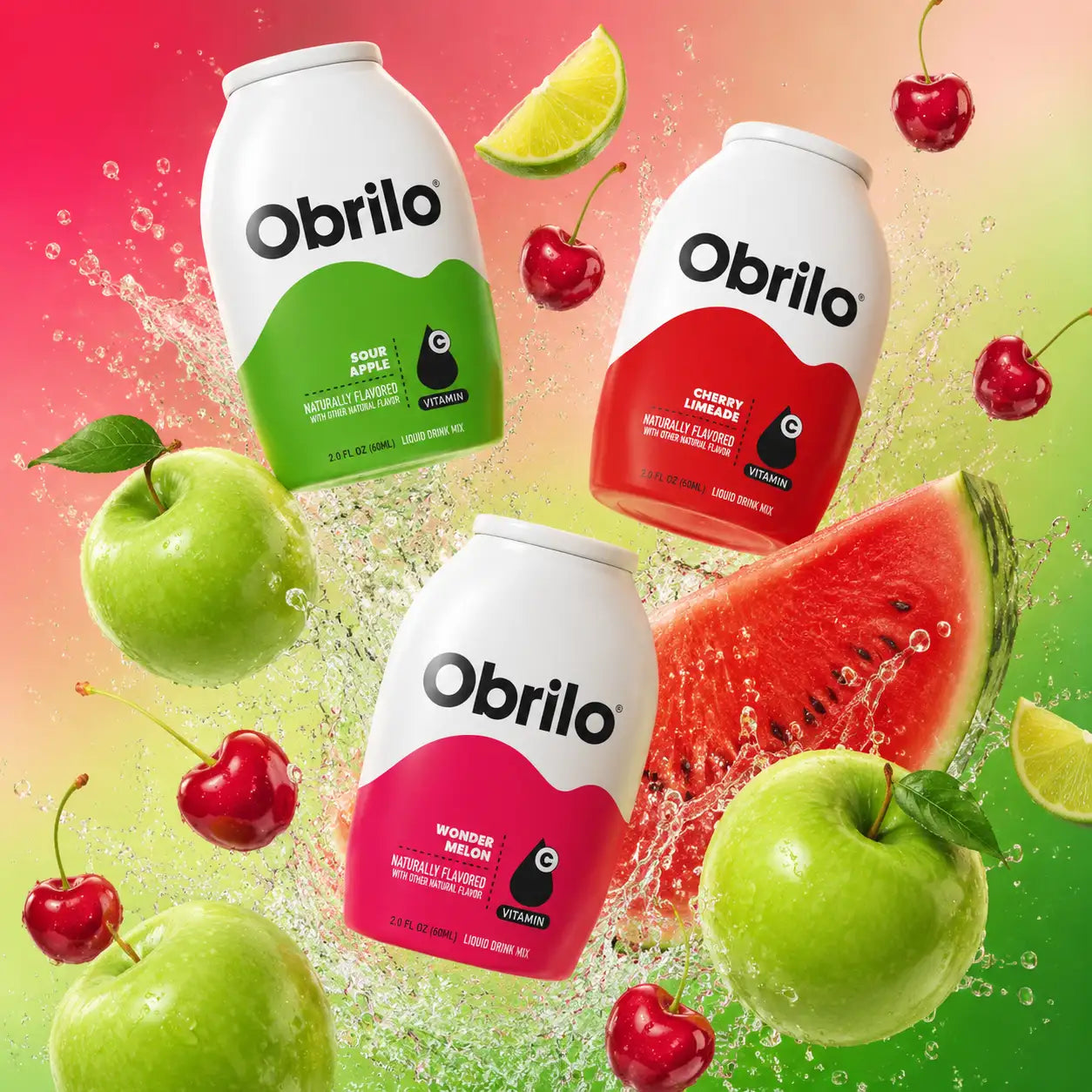 Three white-capped obrilo liquid drink mix bottles, each with a distinct colored label, green for sour apple, red for cherry limeade, and pink for wonder melon, and featuring the brand logo and vitamin indication.